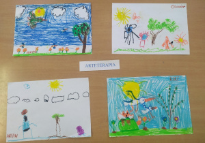 Wiosenne obrazki wykonane przez dzieci pastelami.